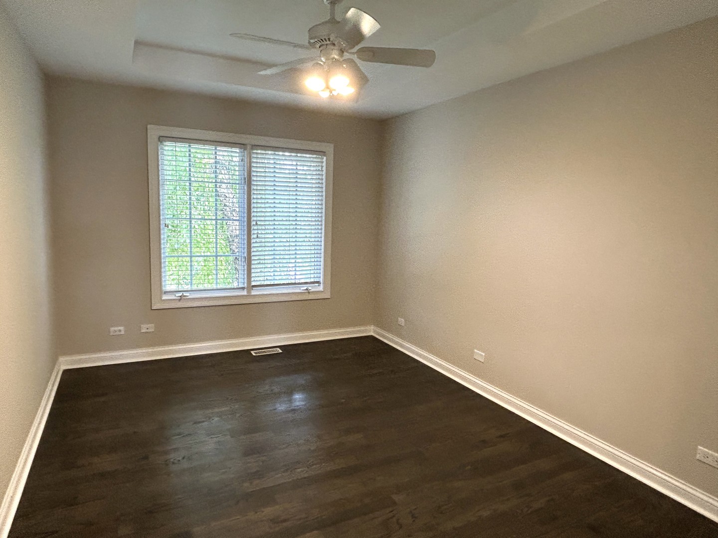 3932 Bluejay Lane Naperville, IL 60564 - Photo 39 of 50 an empty room with wooden floor chandelier fan and windows