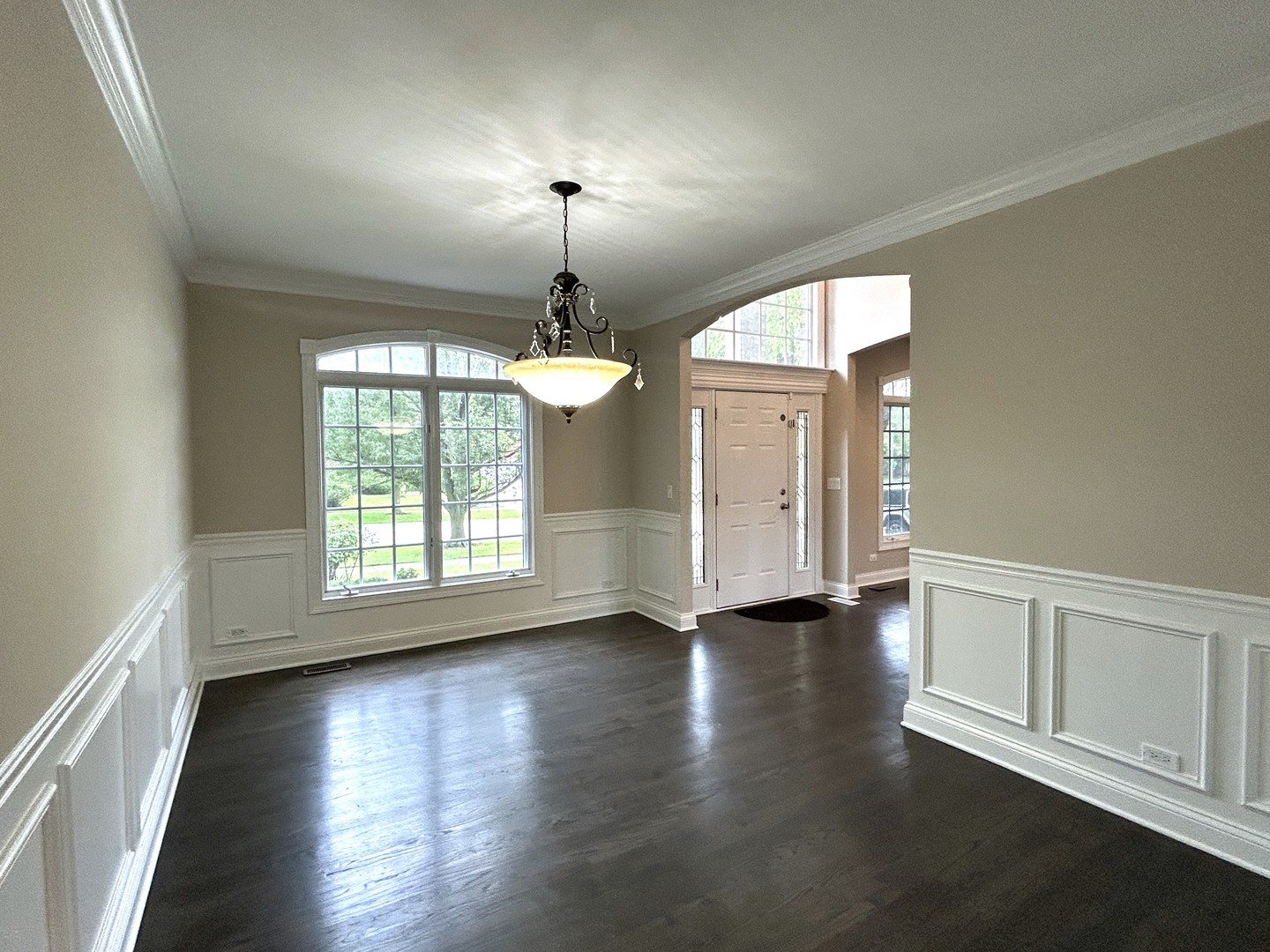 3932 Bluejay Lane Naperville, IL 60564 - Photo 5 of 50 an empty room with wooden floor chandelier and windows