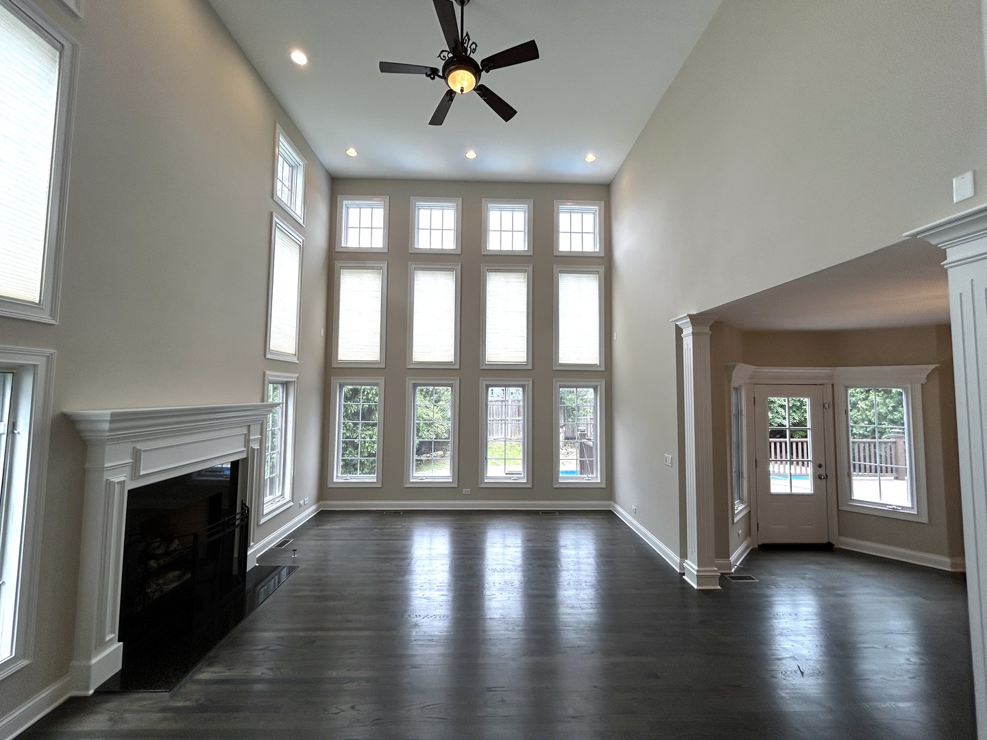3932 Bluejay Lane Naperville, IL 60564 - Photo 8 of 50 a view of an empty room with wooden floor and a window