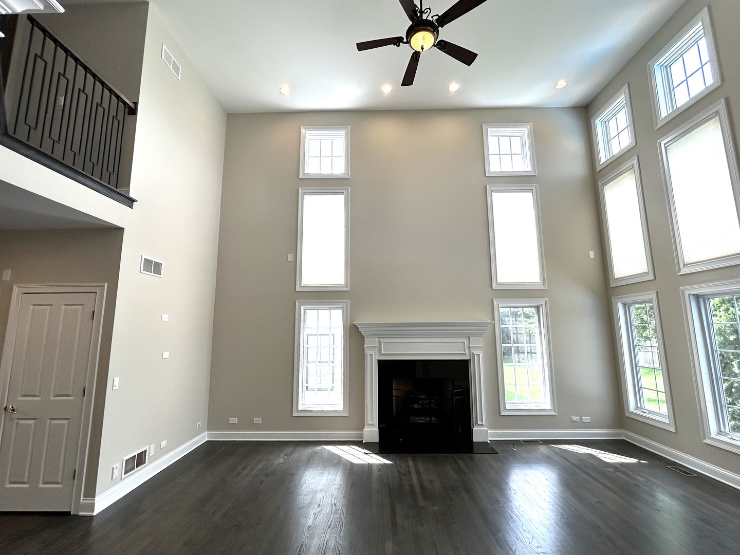 3932 Bluejay Lane Naperville, IL 60564 - Photo 9 of 50 a view of an empty room with wooden floor and a window