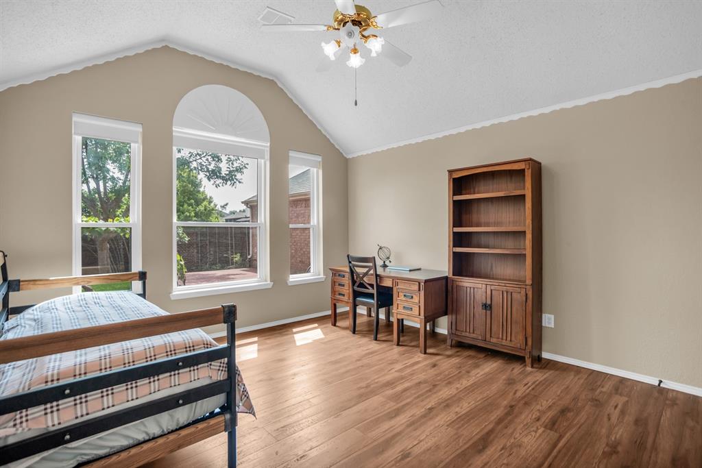 8308 Spring Ridge Drive Plano, TX 75025 - Photo 11 of 28 Room featuring vaulted ceilings and wood-finish flooring