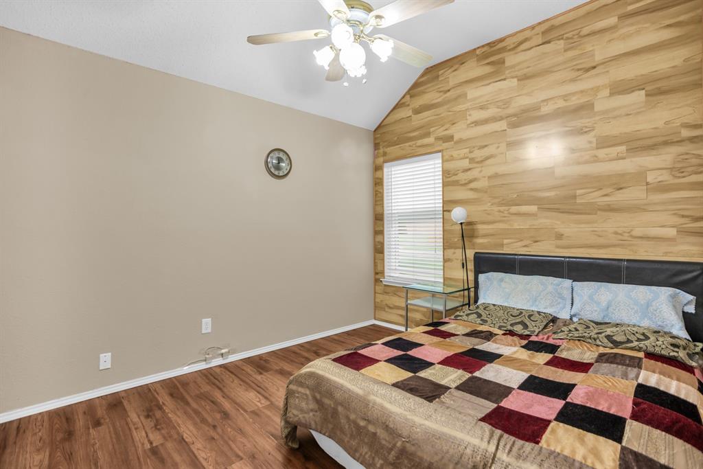 8308 Spring Ridge Drive Plano, TX 75025 - Photo 16 of 28 Vaulted ceiling with a ceiling fan light fixture