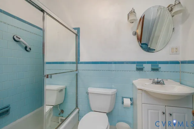 a bedroom with two beds and a window