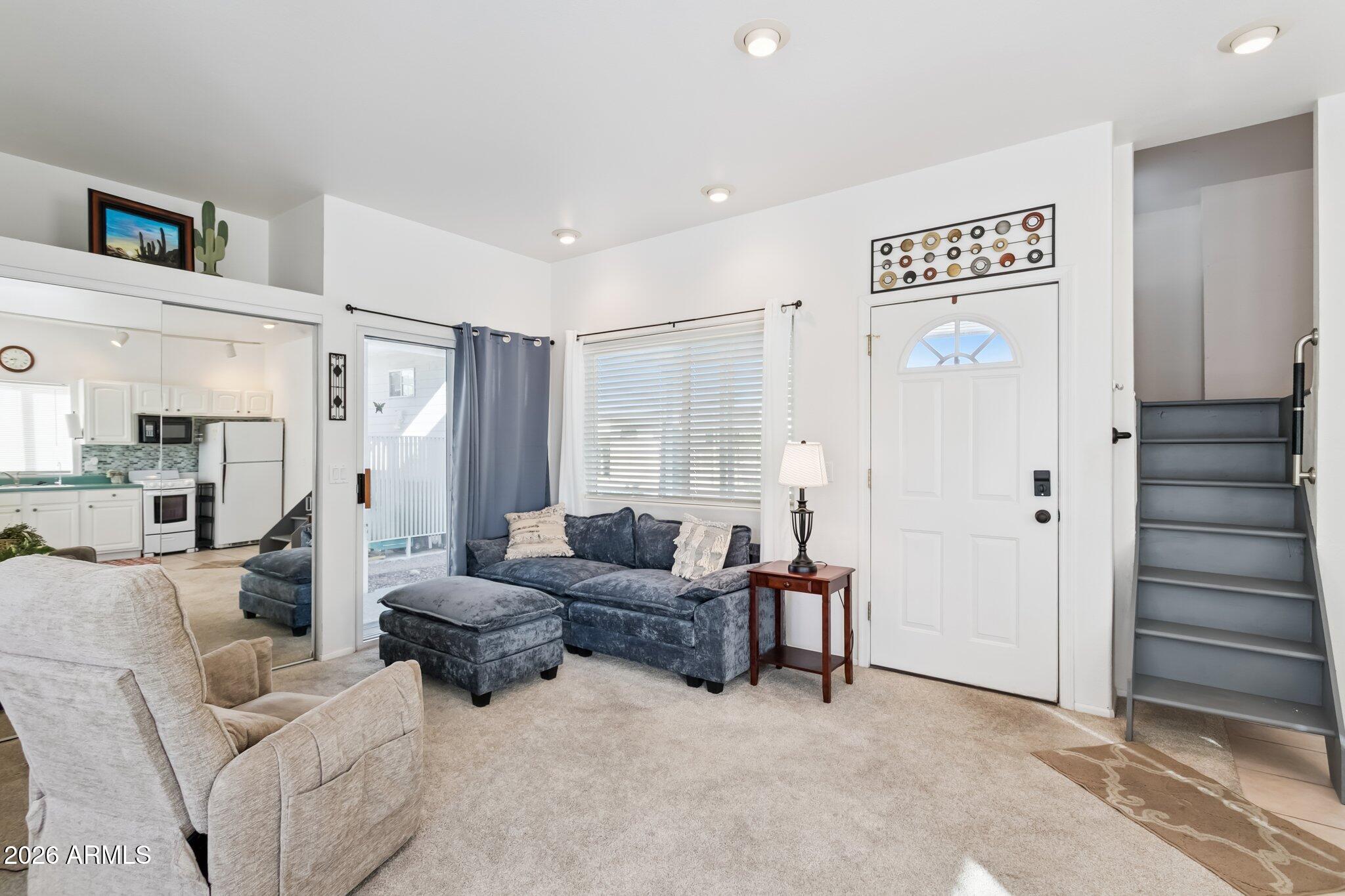 17200 West Bell Road, Unit 869 Surprise, AZ 85374 - Photo 10 of 25 a living room with furniture and a cabinet