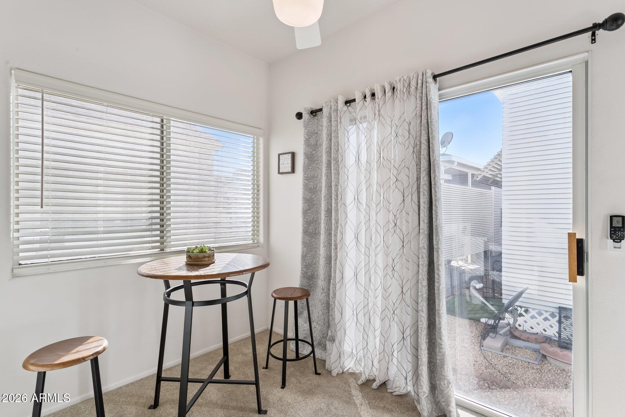 17200 West Bell Road, Unit 869 Surprise, AZ 85374 - Photo 15 of 25 a view of a room with furniture and a window