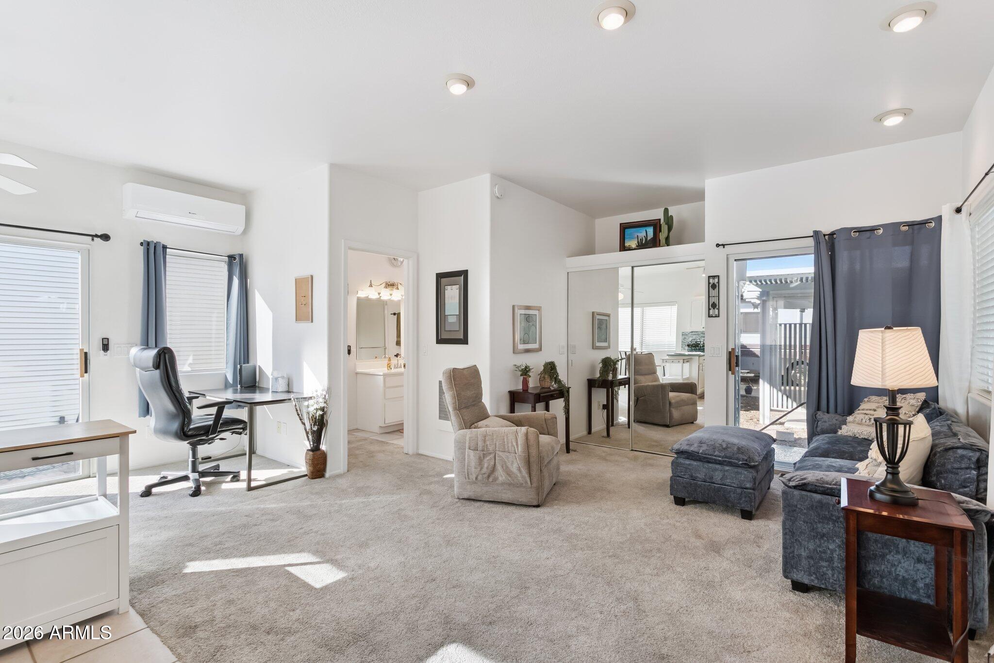 17200 West Bell Road, Unit 869 Surprise, AZ 85374 - Photo 16 of 25 a living room with furniture and a lamp
