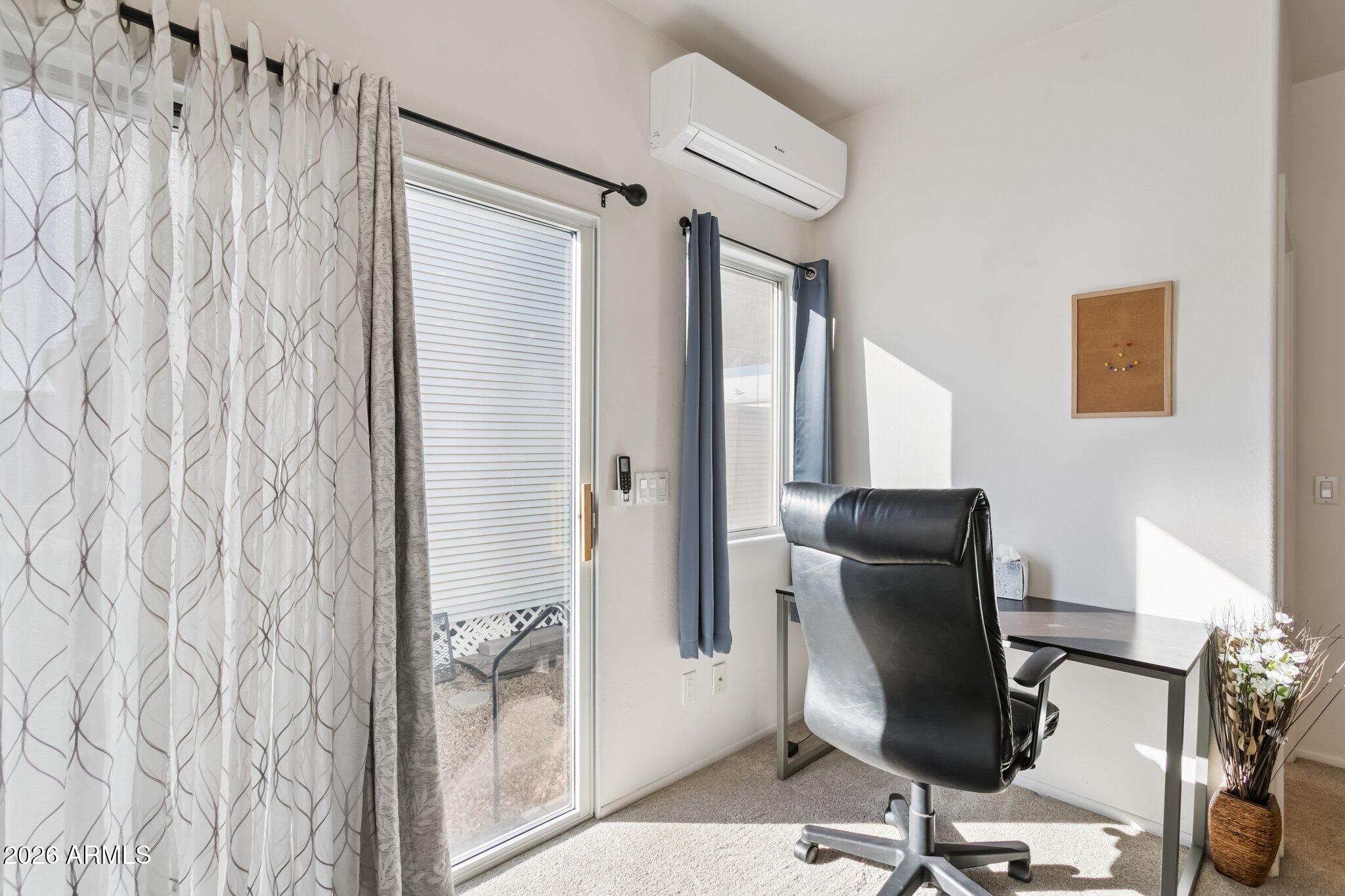 17200 West Bell Road, Unit 869 Surprise, AZ 85374 - Photo 17 of 25 a view of a workspace with furniture and a window