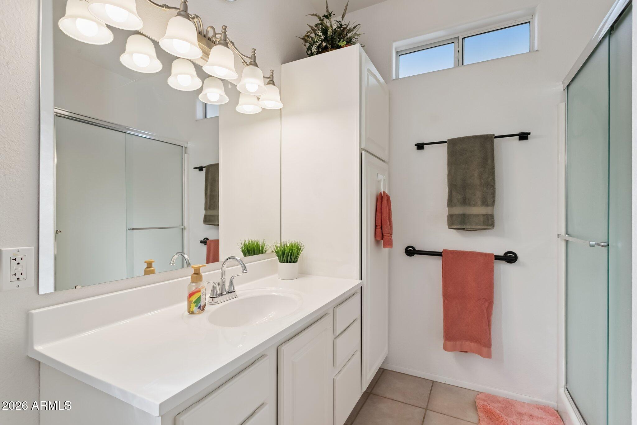 17200 West Bell Road, Unit 869 Surprise, AZ 85374 - Photo 18 of 25 a bathroom with a sink vanity and mirror