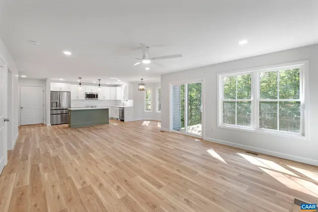 a view of entryway with wooden floor and stairs