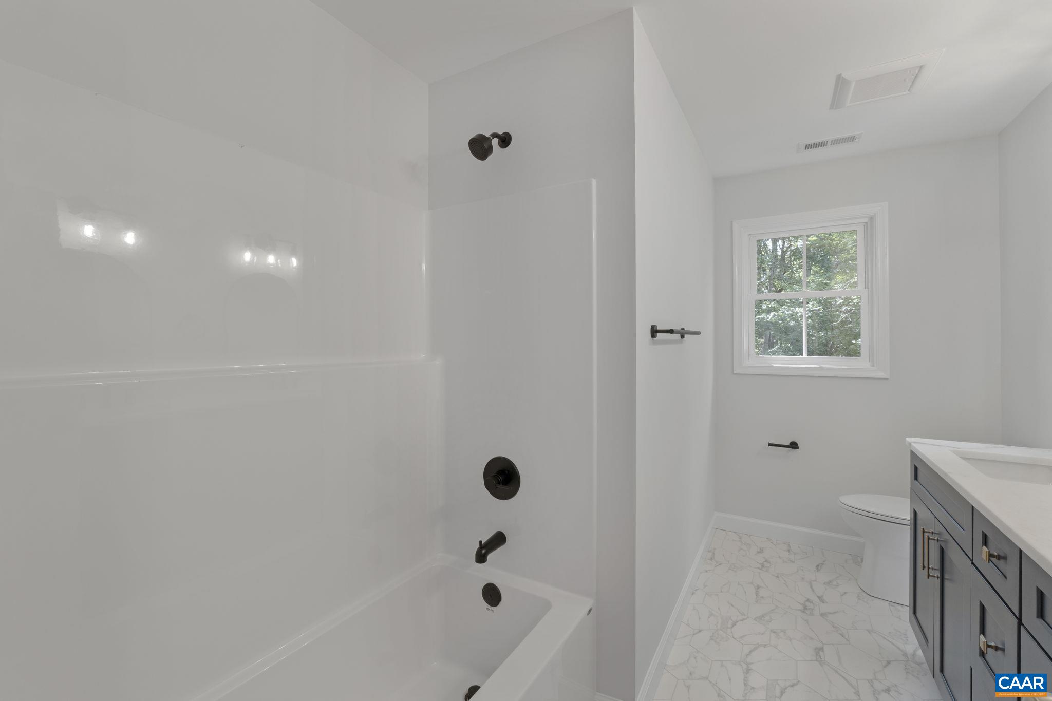 6 Condor Road Palmyra, VA 22963 - Photo 28 of 65 a bathroom with a bathtub