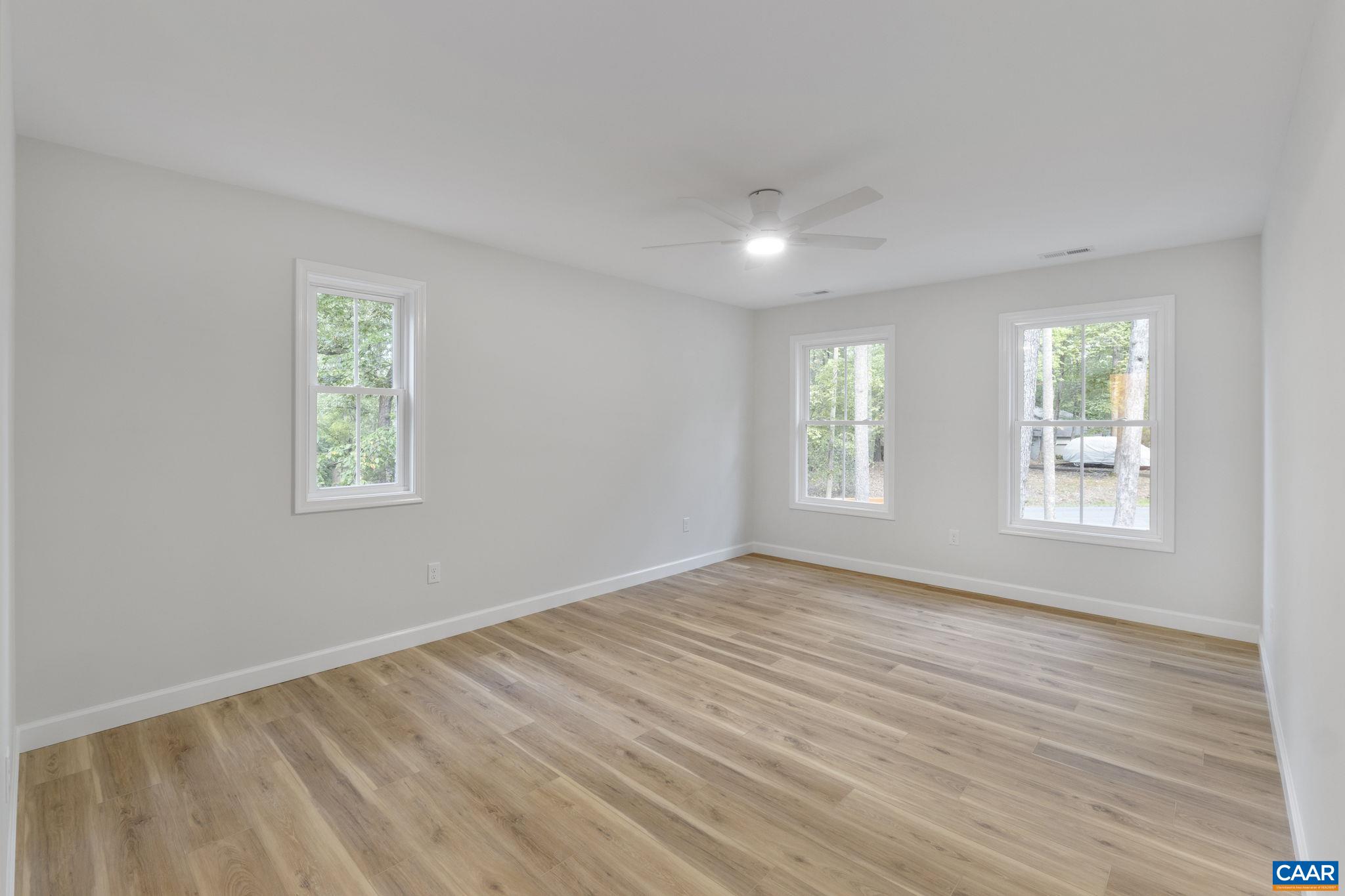6 Condor Road Palmyra, VA 22963 - Photo 32 of 65 a view of an empty room with wooden floor and a window