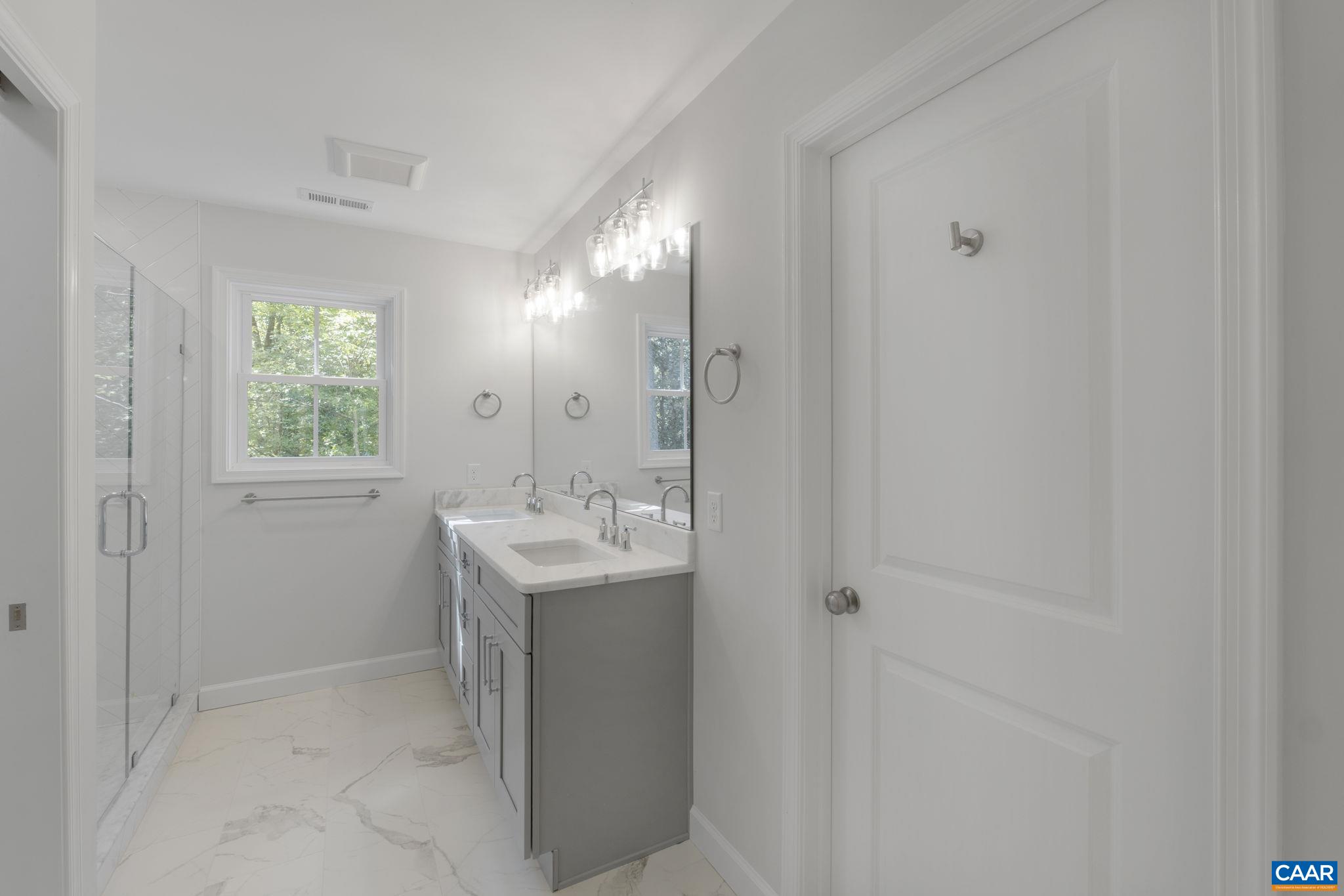 6 Condor Road Palmyra, VA 22963 - Photo 34 of 65 a bathroom with a sink and a mirror