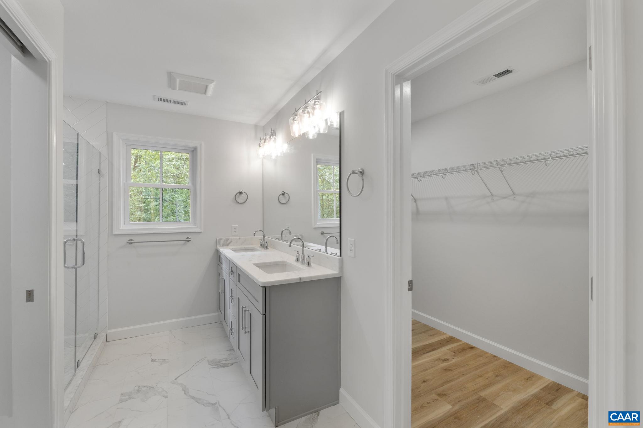 6 Condor Road Palmyra, VA 22963 - Photo 35 of 65 a bathroom with a sink and a mirror