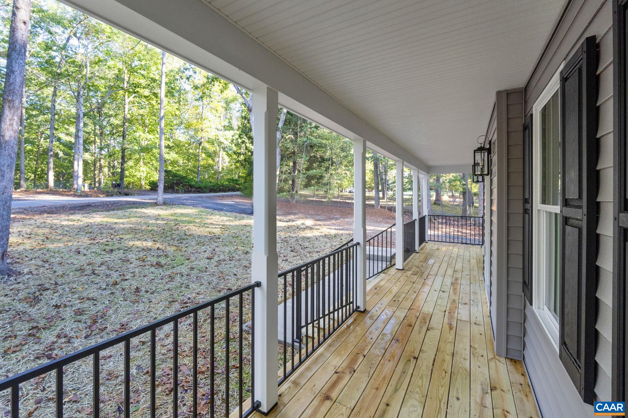 6 Condor Road Palmyra, VA 22963 - Photo 4 of 65 a view of a porch with wooden floor and outdoor space