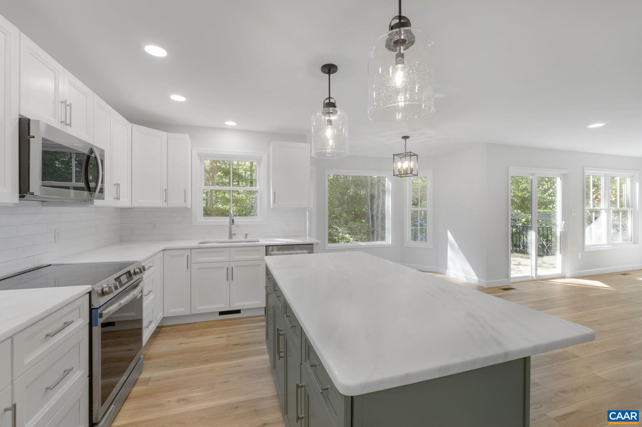 6 Condor Road Palmyra, VA 22963 - Photo 5 of 65 a kitchen with granite countertop a stove a sink dishwasher and a refrigerator with wooden floor