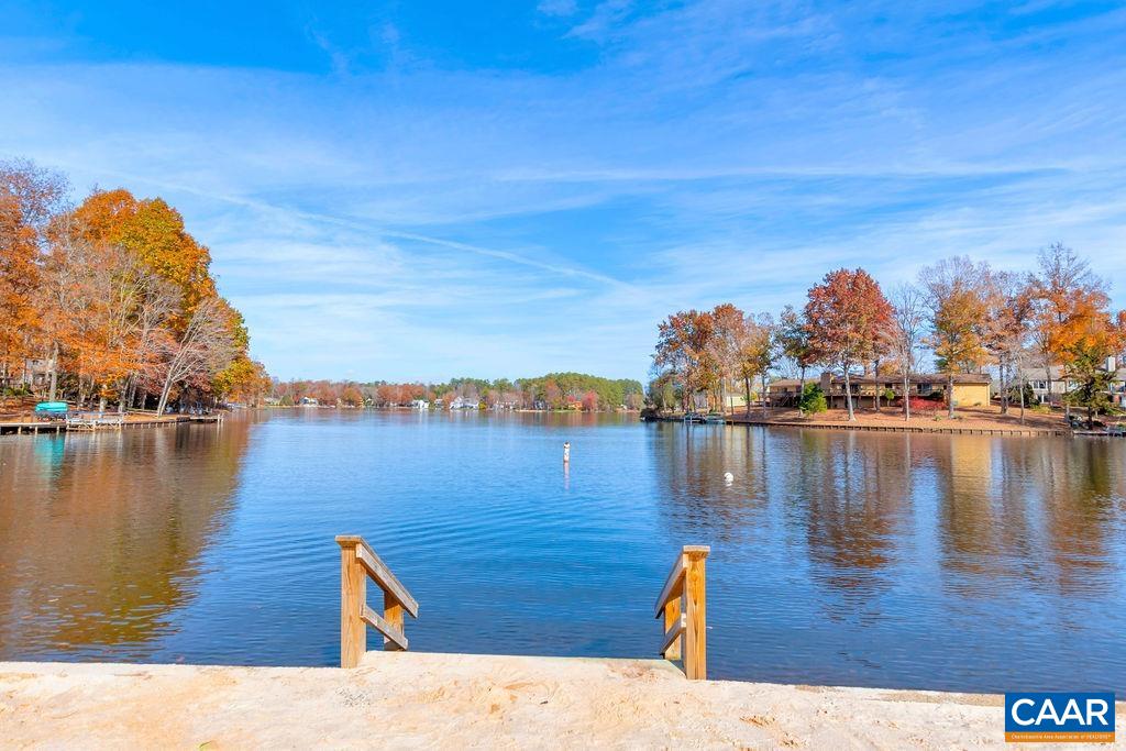 6 Condor Road Palmyra, VA 22963 - Photo 59 of 65 a view of a lake with boats and trees in the background