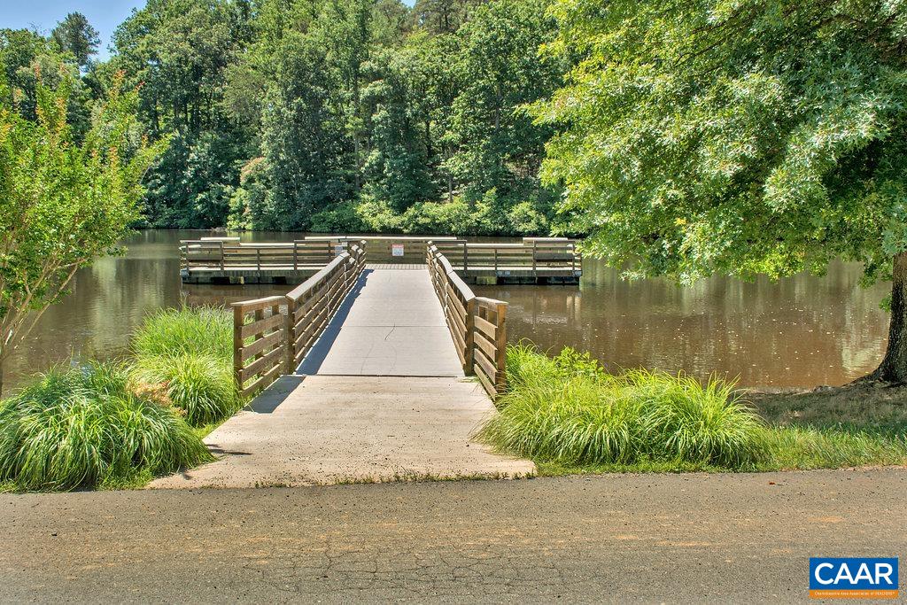 6 Condor Road Palmyra, VA 22963 - Photo 60 of 65 a view of a wooden deck and lake
