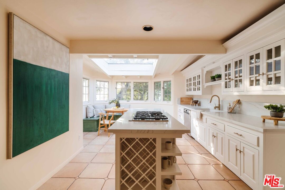 21580 Encina Road Topanga, CA 90290 - Photo 11 of 38 a kitchen with a sink and a stove top oven