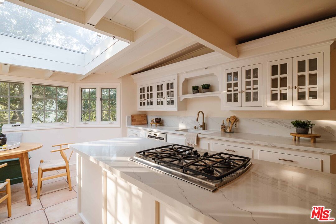 21580 Encina Road Topanga, CA 90290 - Photo 12 of 38 a kitchen with a stove and a sink