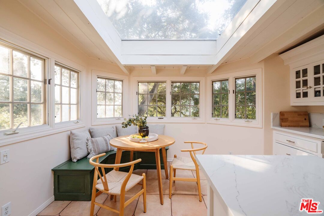 21580 Encina Road Topanga, CA 90290 - Photo 13 of 38 a dining room with furniture and window