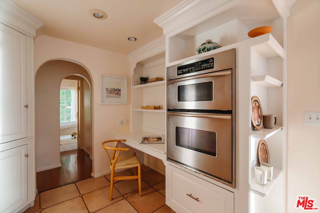 21580 Encina Road Topanga, CA 90290 - Photo 14 of 38 a kitchen with stainless steel appliances and cabinets