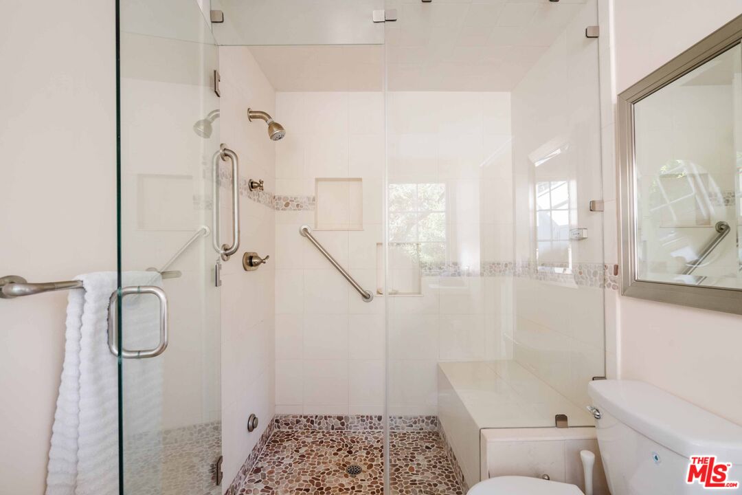 21580 Encina Road Topanga, CA 90290 - Photo 19 of 38 a bathroom with a shower and a toilet