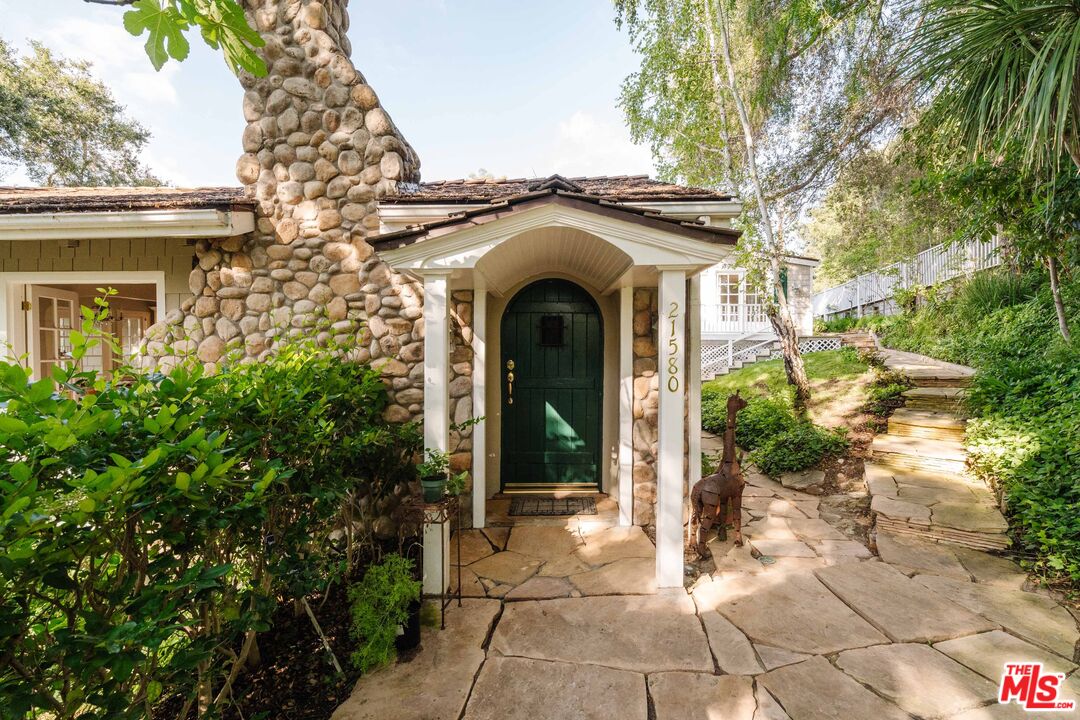 21580 Encina Road Topanga, CA 90290 - Photo 2 of 38 a view of a house with potted plants