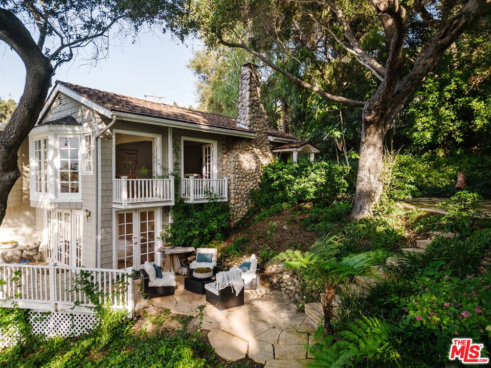 21580 Encina Road Topanga, CA 90290 - Photo 32 of 38 a view of a house with a yard