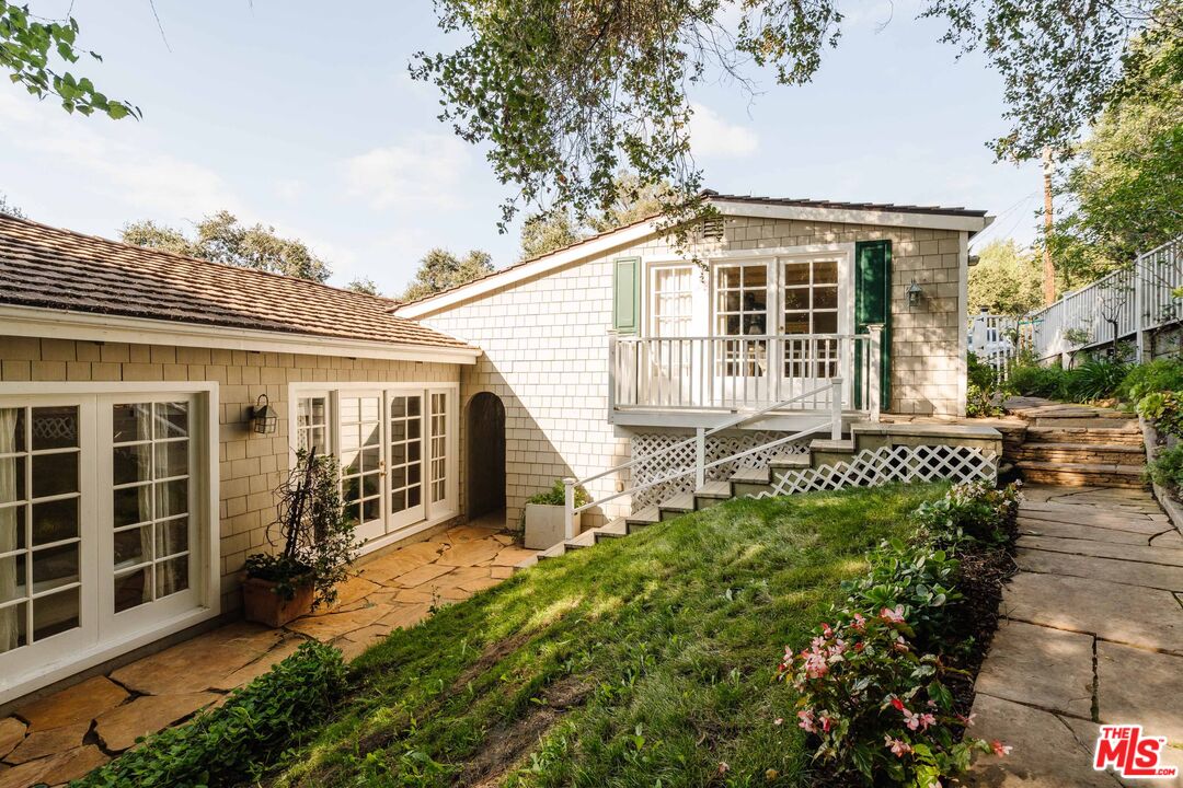 21580 Encina Road Topanga, CA 90290 - Photo 33 of 38 front view of a house with a yard