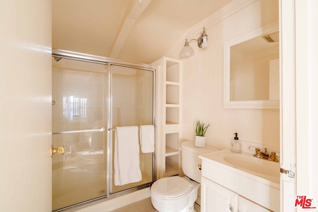 21580 Encina Road Topanga, CA 90290 - Photo 36 of 38 a bathroom with a sink a toilet and shower