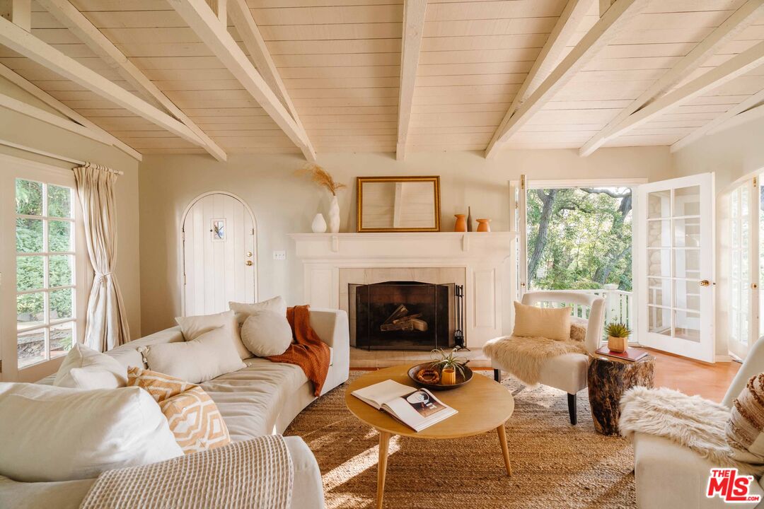 21580 Encina Road Topanga, CA 90290 - Photo 4 of 38 a living room with furniture and a fireplace