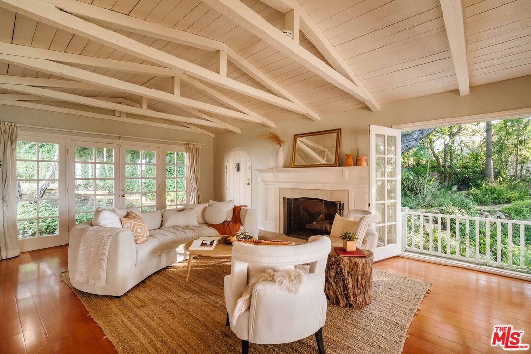 21580 Encina Road Topanga, CA 90290 - Photo 5 of 38 a living room with furniture and a fireplace