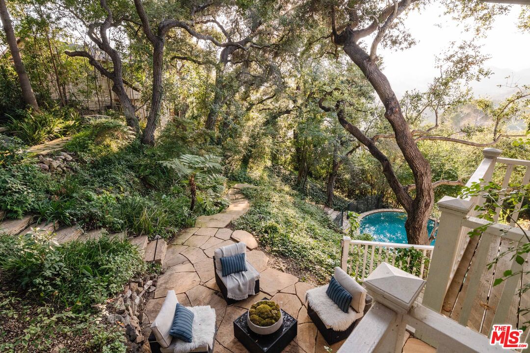 21580 Encina Road Topanga, CA 90290 - Photo 8 of 38 a view of a balcony with furniture and a potted plant