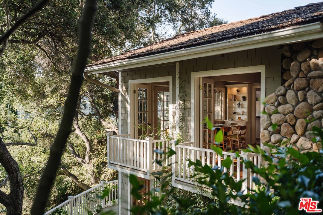 21580 Encina Road Topanga, CA 90290 - Photo 9 of 38 front view of a house with a porch