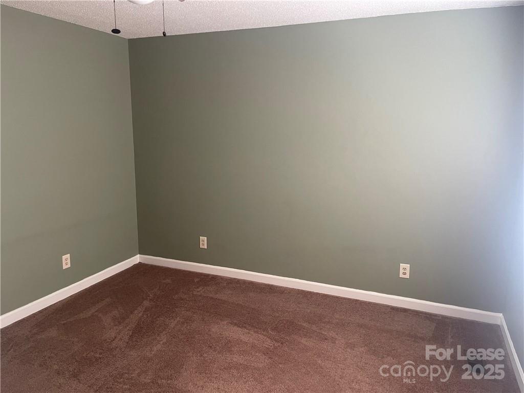 1425 20th Avenue Northeast Hickory, NC 28601 - Photo 12 of 22 a view of an empty room with a ceiling fan