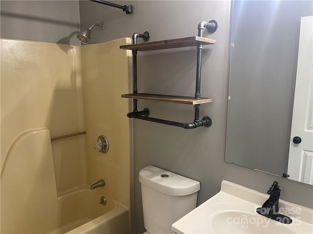 1425 20th Avenue Northeast Hickory, NC 28601 - Photo 13 of 22 a bathroom with a sink a toilet and a shower