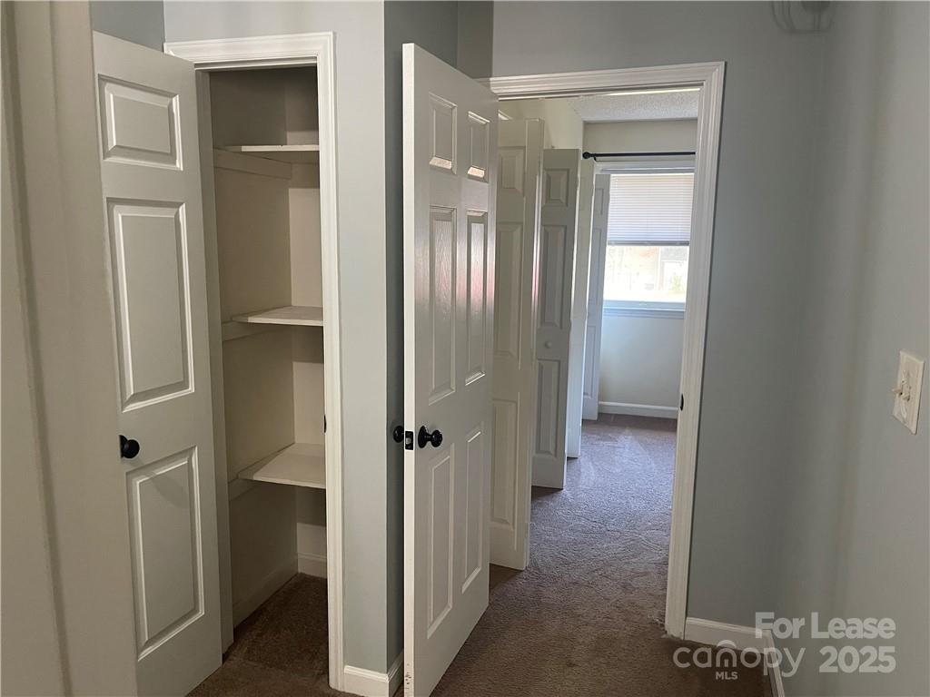 1425 20th Avenue Northeast Hickory, NC 28601 - Photo 15 of 22 a view of a hallway with wooden floor and closet area