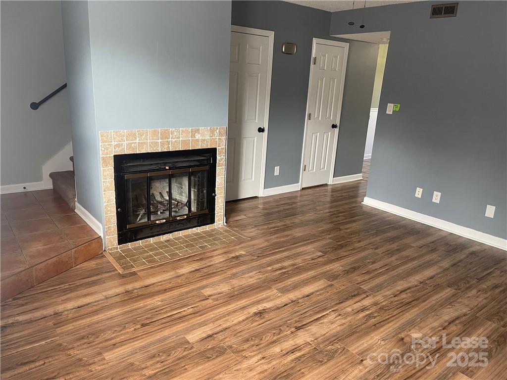 1425 20th Avenue Northeast Hickory, NC 28601 - Photo 2 of 22 a view of a livingroom with wooden floor and a fireplace