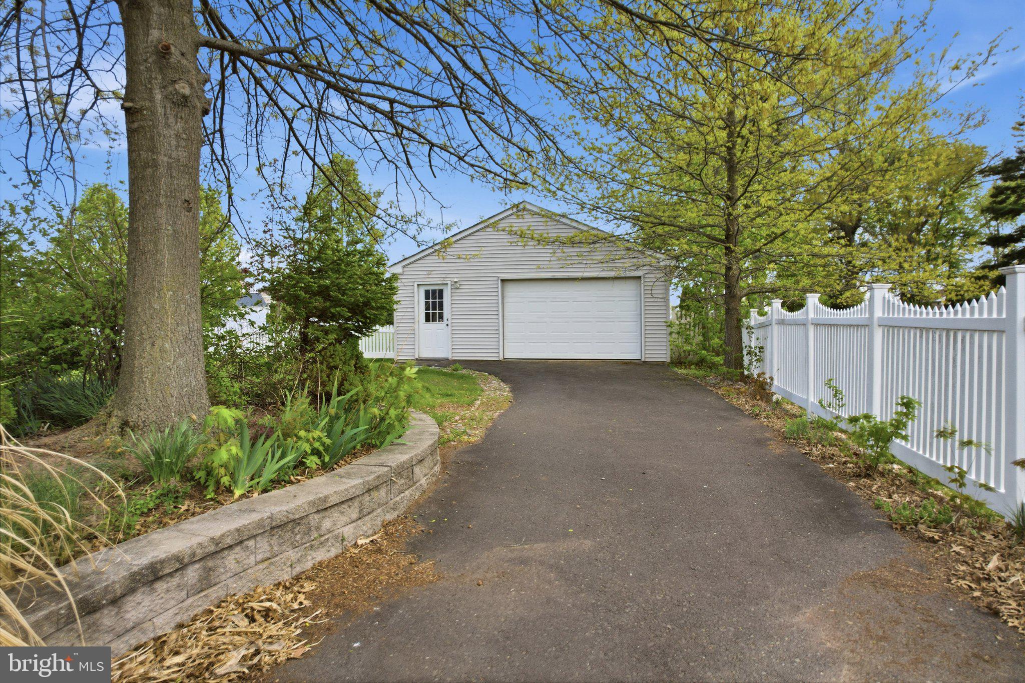 684 Hunsicker Road Telford, PA 18969 - Photo 55 of 89 Charming garage nestled in greenery.