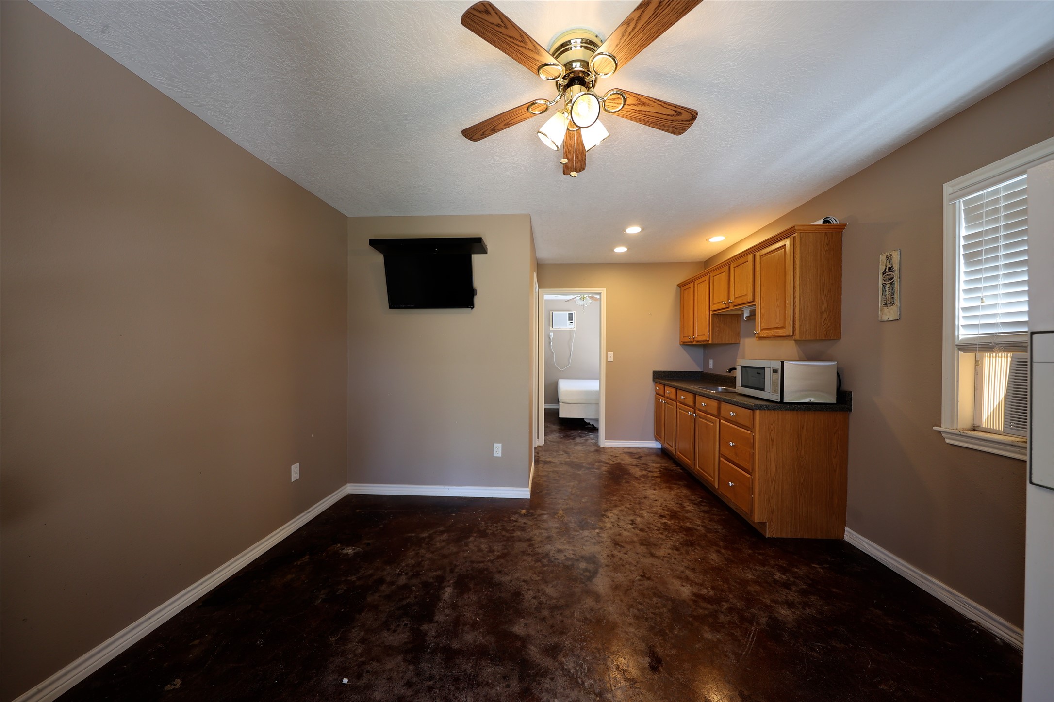 3337 Brunes Mill Road Columbus, TX 78934 - Photo 28 of 48 a kitchen with stainless steel appliances granite countertop a refrigerator a stove top oven a sink and dishwasher