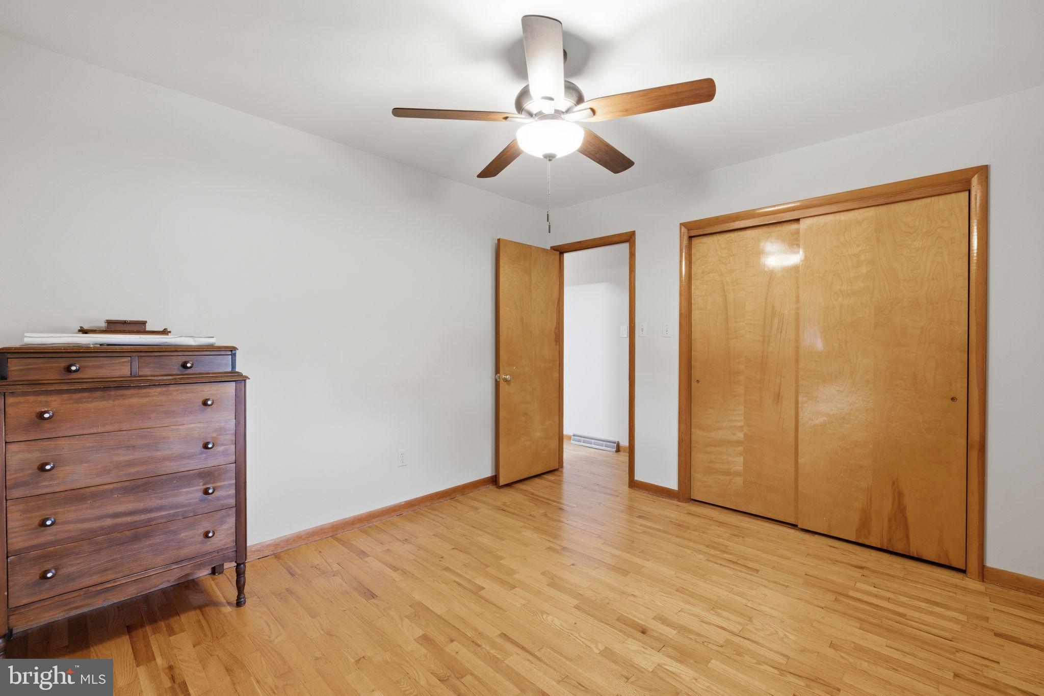 14983 Charles Town Road Charles Town, WV 25414 - Photo 33 of 80 a view of room with hardwood floor and ceiling fan