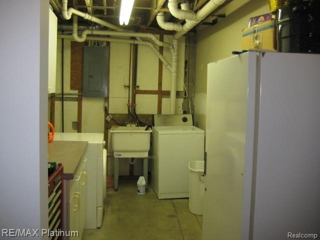 262 South Burkhart Road Howell, MI 48843 - Photo 20 of 21 BASEMENT LAUNDRY