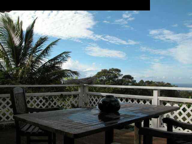 125 Ulumalu Road Haiku, HI 96708 - Photo 1 of 13 a table with chairs and a table in front of it