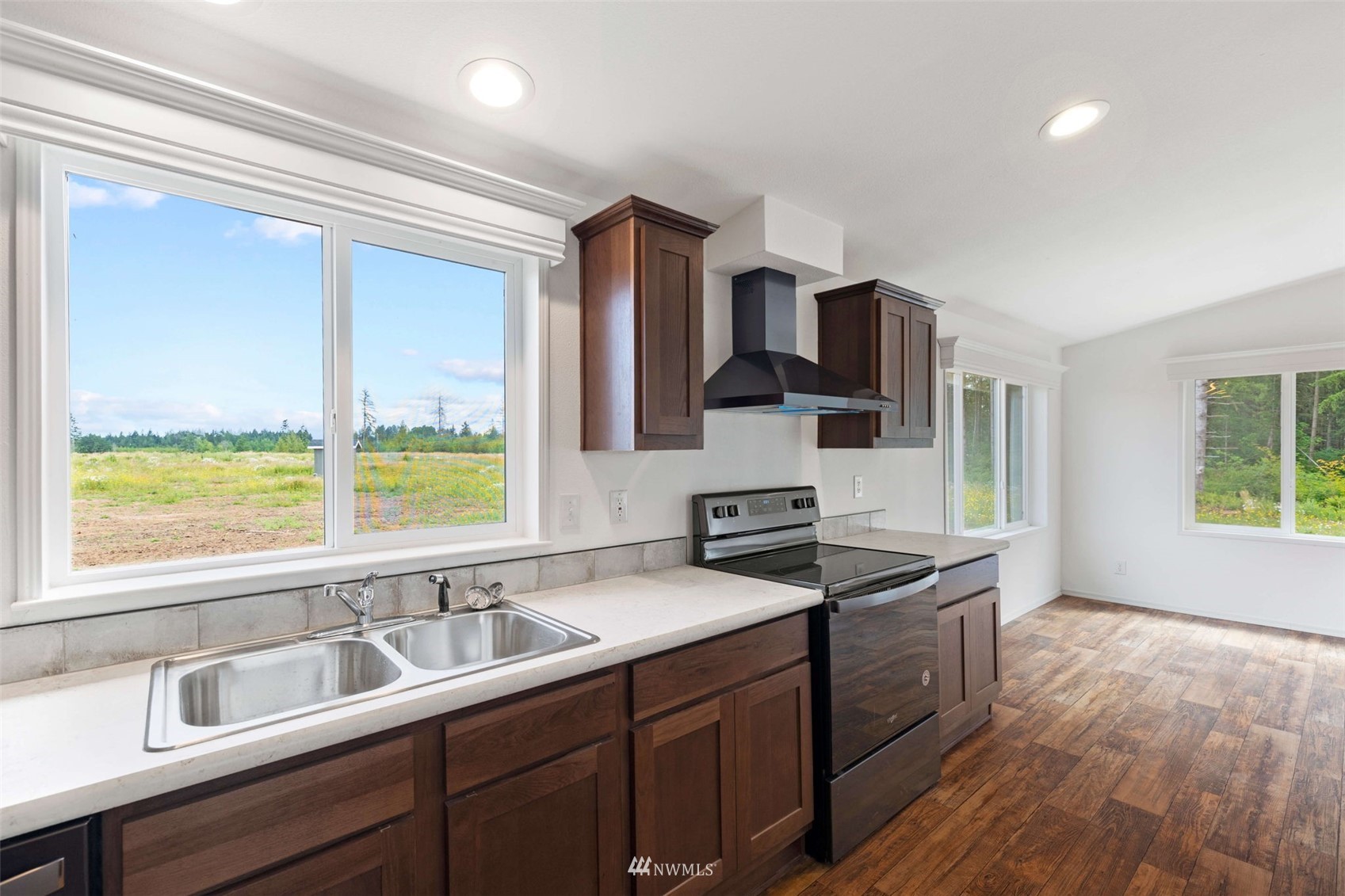 459 Antrim Road Winlock, WA 98596 - Photo 13 of 40 a kitchen with a sink stove and cabinets