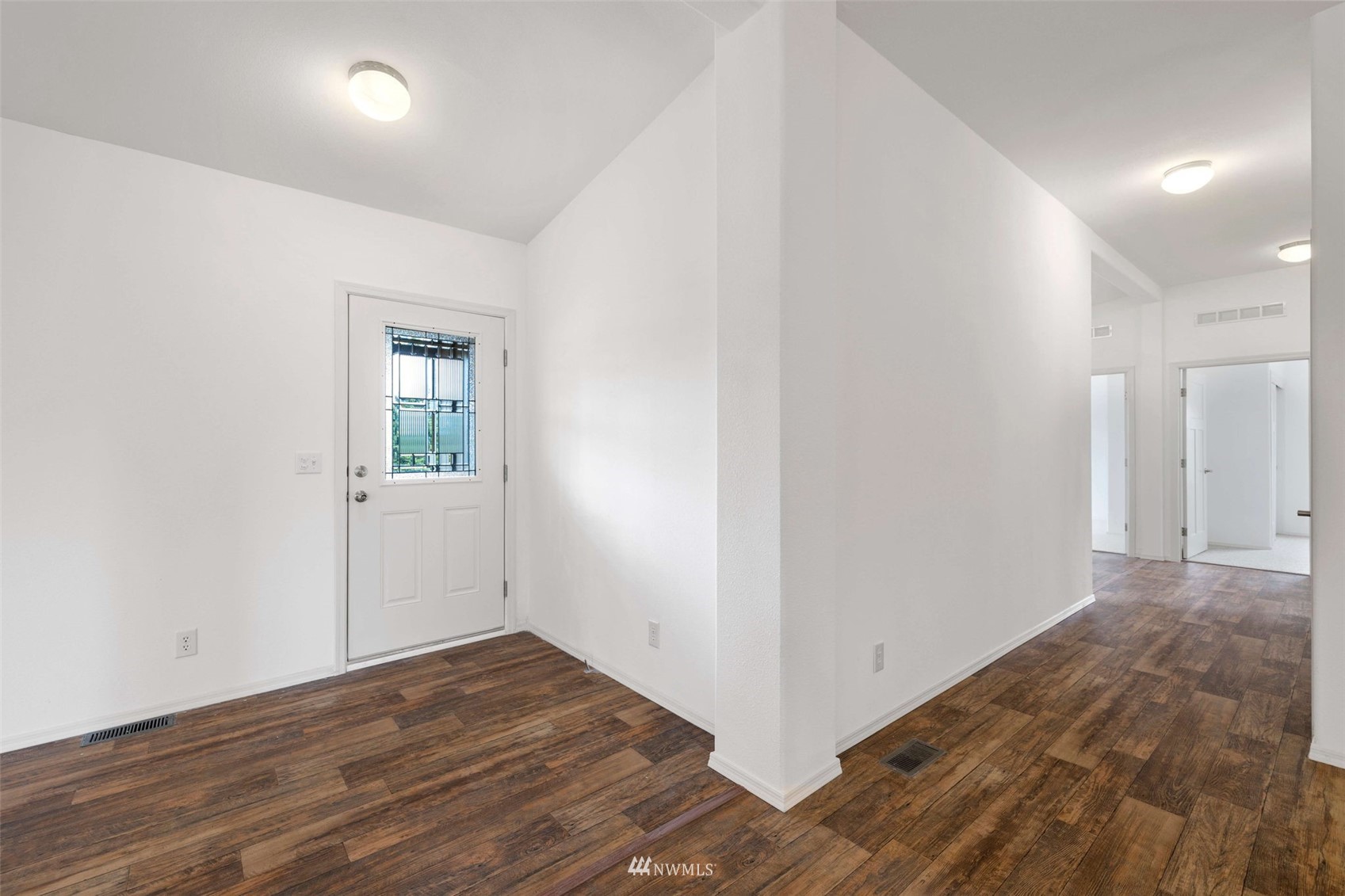 459 Antrim Road Winlock, WA 98596 - Photo 7 of 40 a view of a hallway with wooden floor