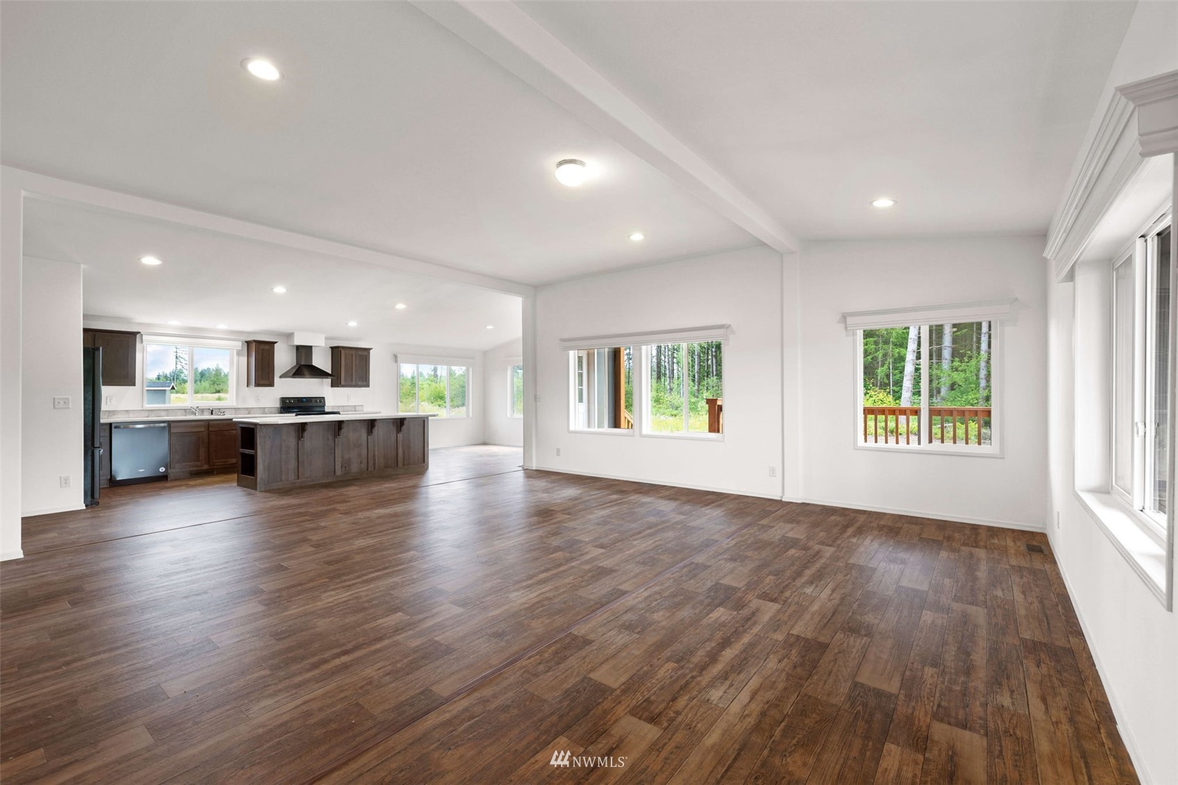 459 Antrim Road Winlock, WA 98596 - Photo 8 of 40 an empty room with wooden floor and windows
