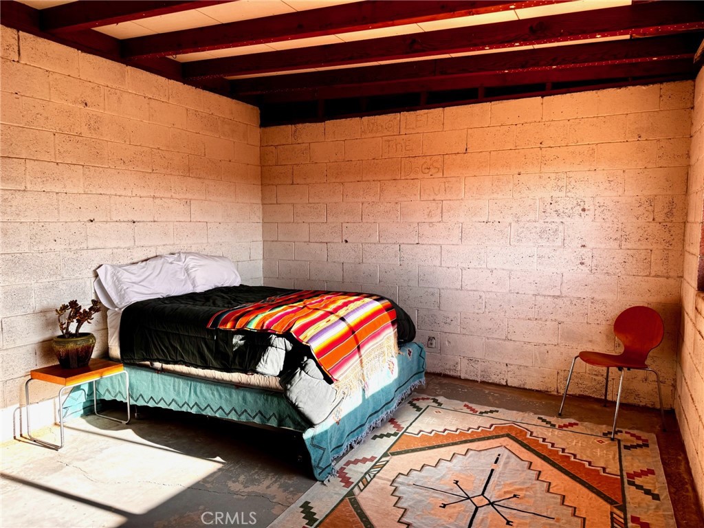 6615 Thunder Road Twentynine Palms, CA 92277 - Photo 13 of 14 a bedroom with a bed and a window