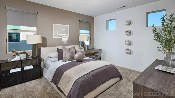 a bed room with a bed and a potted plant
