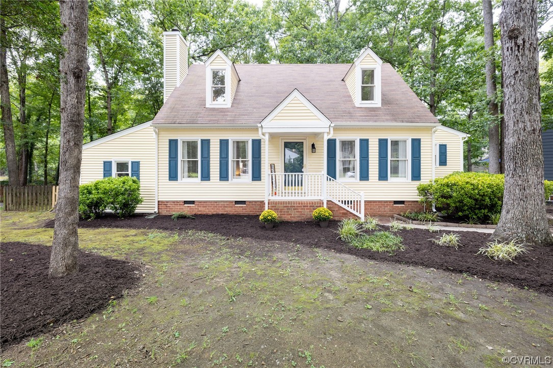 2406 Arrowood Road Midlothian, VA 23112 - Photo 1 of 39 a front view of a house with a garden and trees