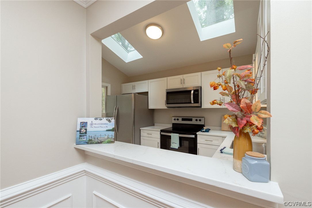 2406 Arrowood Road Midlothian, VA 23112 - Photo 11 of 39 a kitchen with stainless steel appliances kitchen island granite countertop a refrigerator and a sink